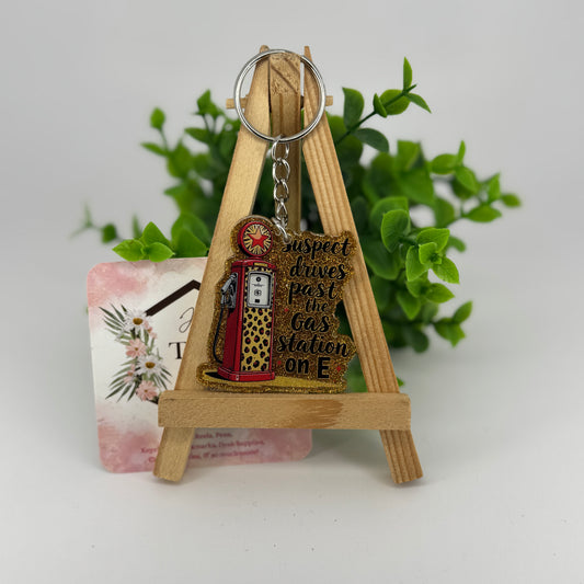 Suspect Drives Past Gas Station on E Glittered Keychain / Bag Tag