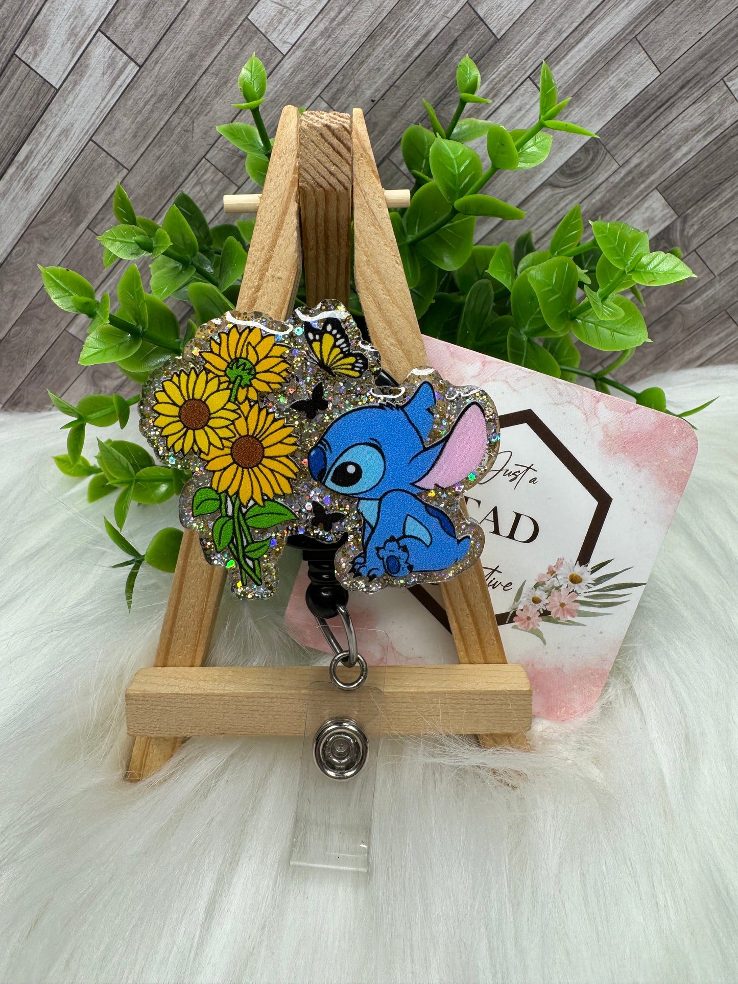 Blue Alien Smelling Sunflowers Interchangeable Badge Reel Topper