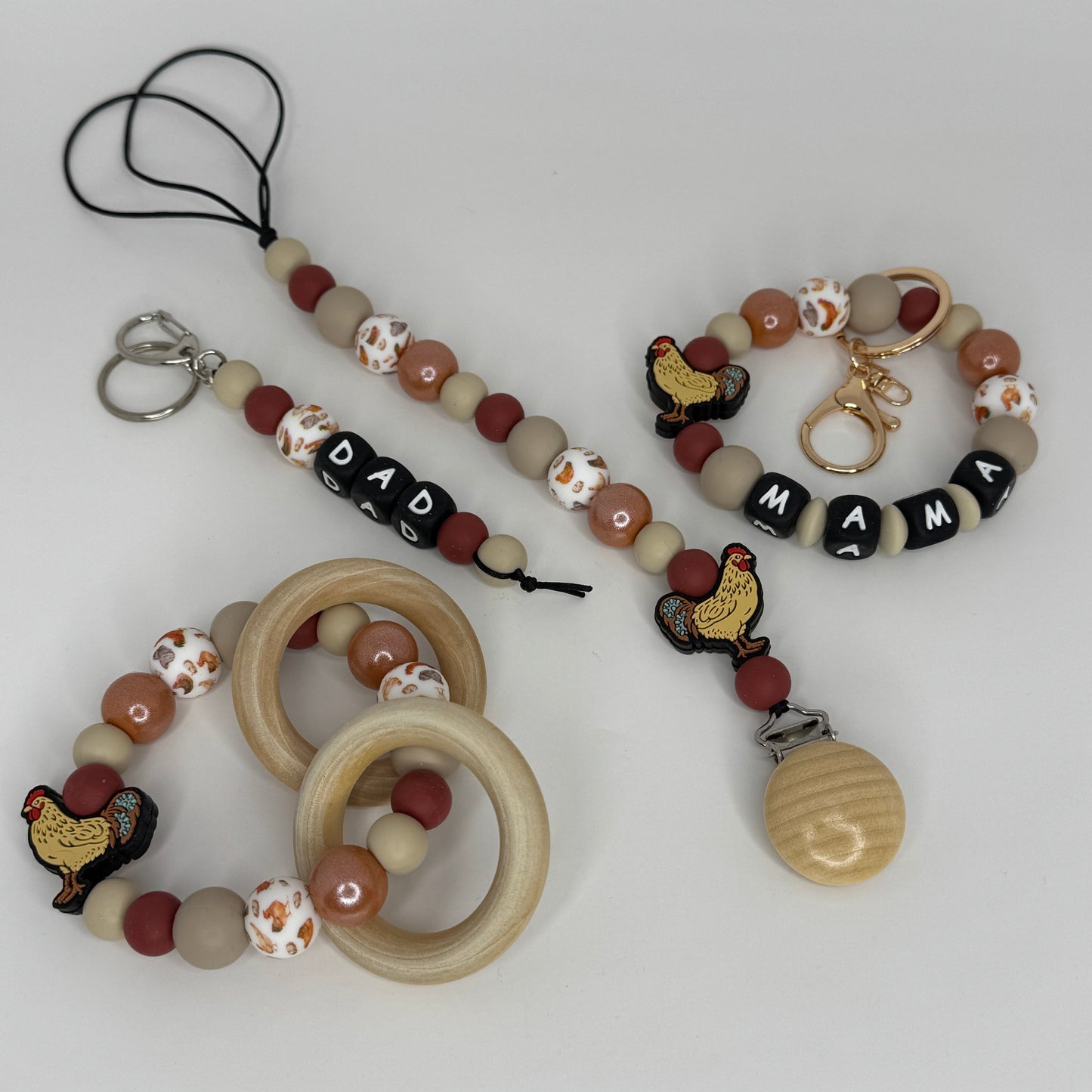 Family Fun Chicken-Themed Baby Bundle – Pacifier Holder, Teether, Mama Wristlet & Dad Keychain